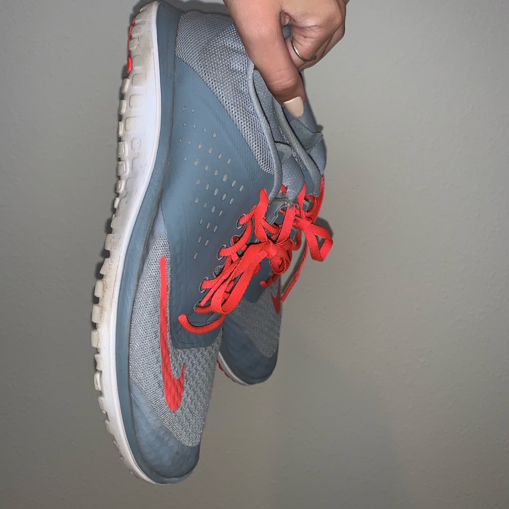 Grey and hot pink nike shoes